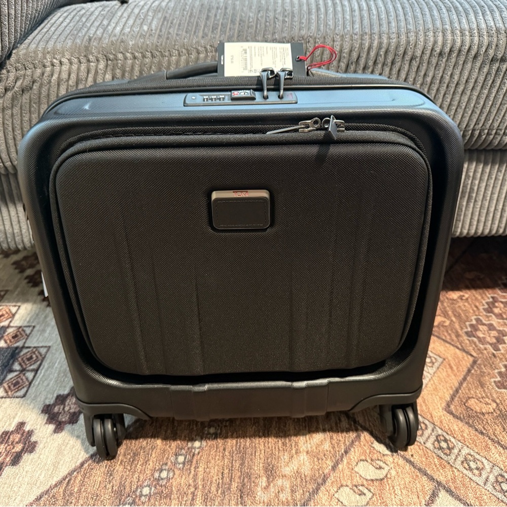 Tumi hard sided carry on luggage